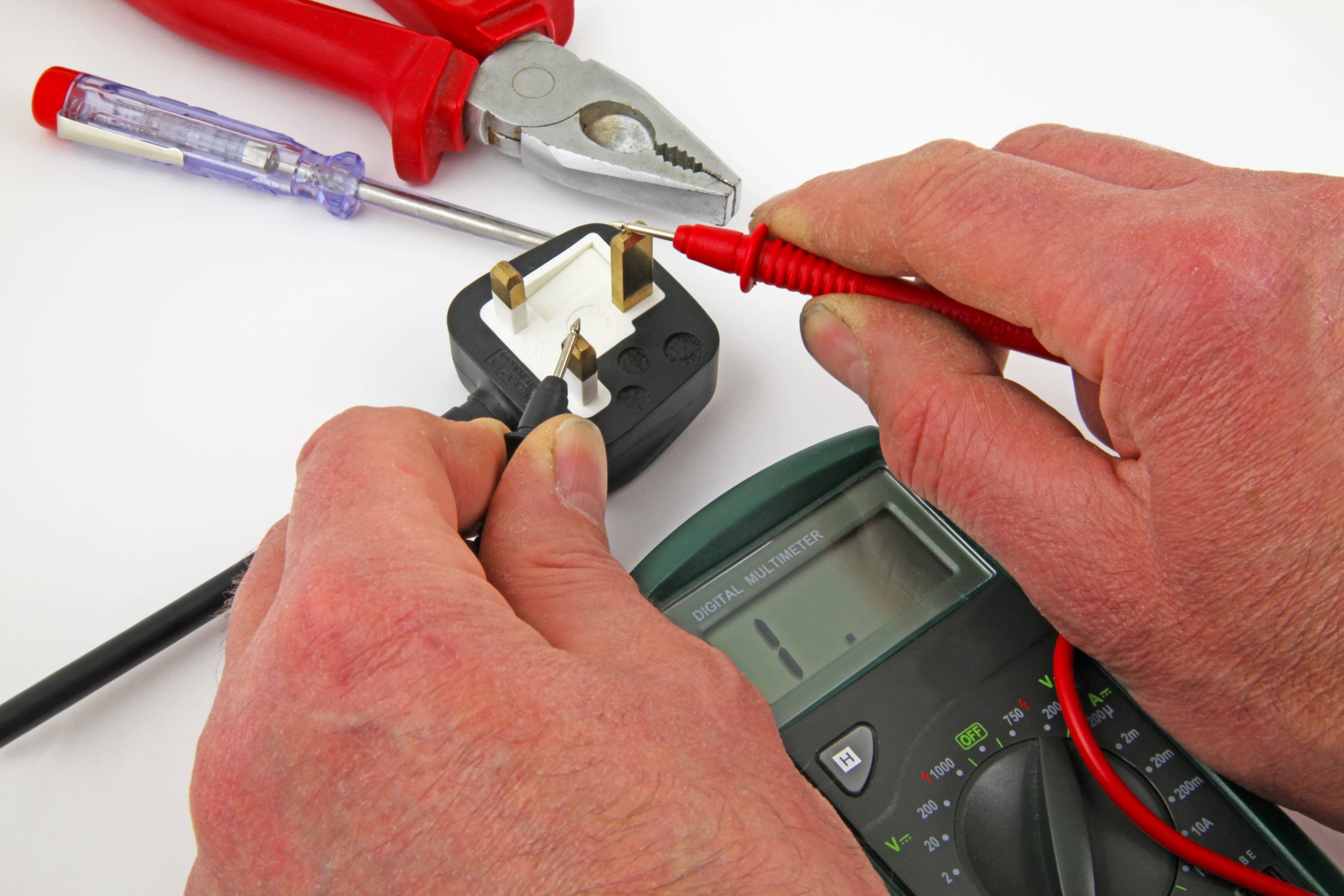 An engineer carrying out PAT Testing